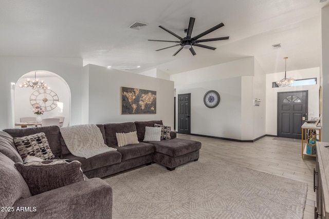 756 E Appaloosa Rd, Gilbert, AZ 85296 - living area with a chandelier, light wood-style flooring, a ceiling fan, lofted ceiling, and arched walkways