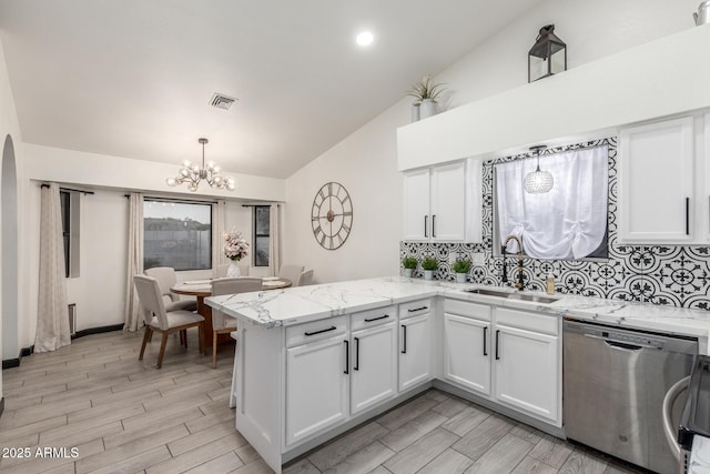 756 E Appaloosa Rd, Gilbert, AZ 85296 - kitchen featuring stainless steel dishwasher, a sink, lofted ceiling, a chandelier, and a peninsula