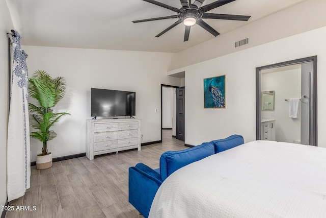 756 E Appaloosa Rd, Gilbert, AZ 85296 - bedroom with lofted ceiling, wood finished floors, baseboards, connected bathroom, and a ceiling fan