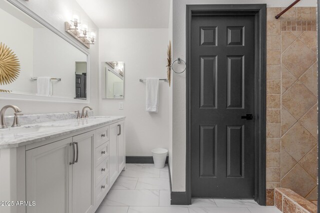 756 E Appaloosa Rd, Gilbert, AZ 85296 - bathroom with marble finish flooring, double vanity, baseboards, toilet, and tiled shower