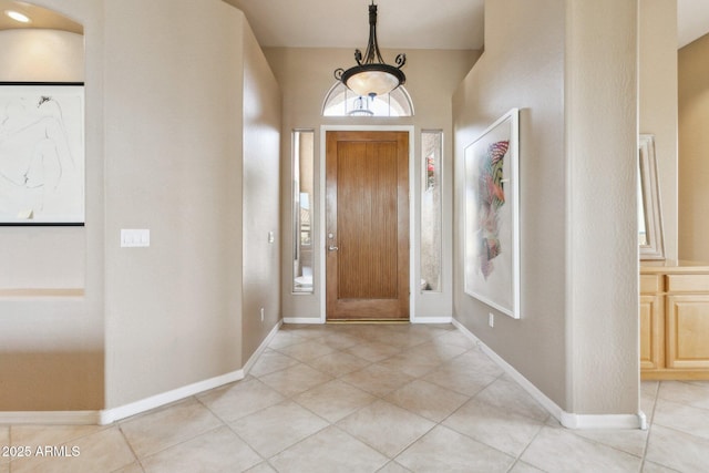 foyer entrance with light tile patterned floors