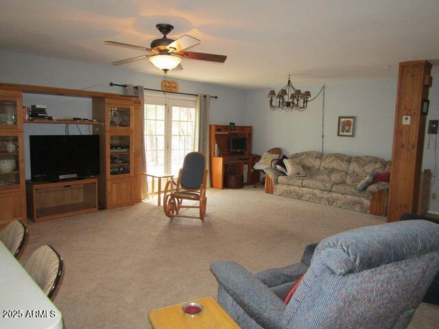 2007 N Murchison Cir, Payson, AZ 85541 - living area with light carpet, a chandelier, and ceiling fan