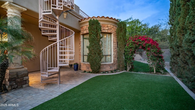 4332 N Santiago Cir, Mesa, AZ 85215 - property entrance featuring stucco siding, stone siding, and a lawn
