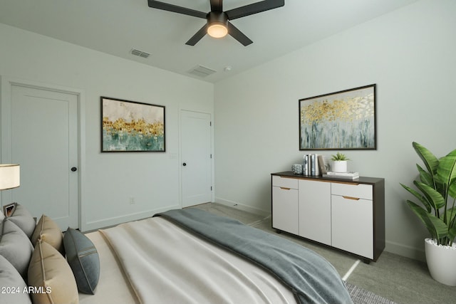 bedroom with ceiling fan and light carpet