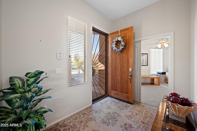 entryway featuring baseboards