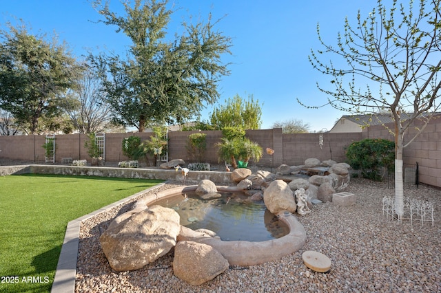 view of yard featuring a fenced backyard