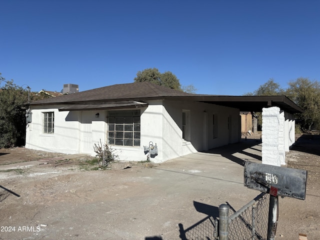 view of front of home with a carport