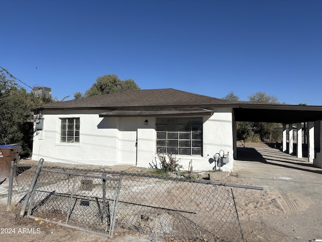 view of front of home with a carport