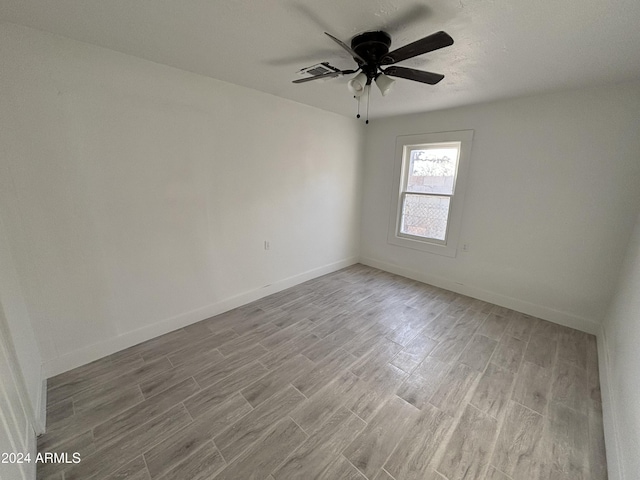 unfurnished room featuring ceiling fan and light hardwood / wood-style flooring