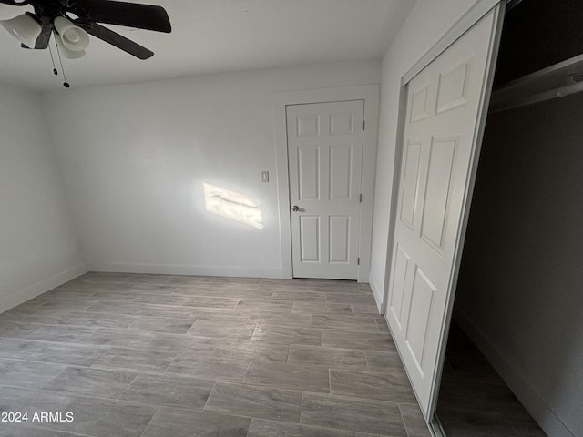 unfurnished bedroom featuring ceiling fan