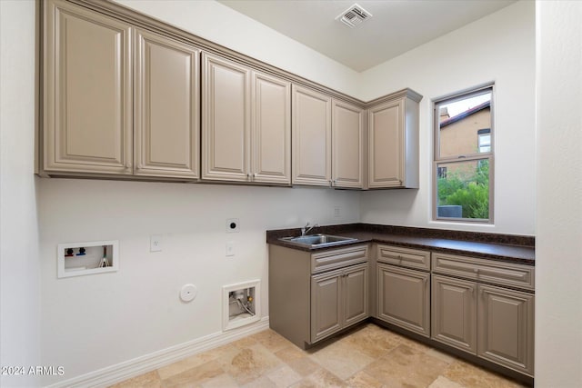 washroom with cabinet space, visible vents, a sink, washer hookup, and electric dryer hookup