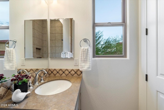 bathroom with backsplash and vanity