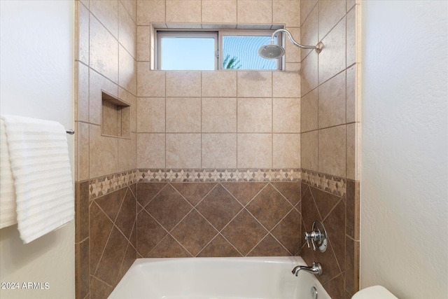 bathroom with toilet and shower / tub combination