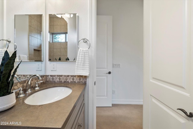 bathroom featuring baseboards and vanity