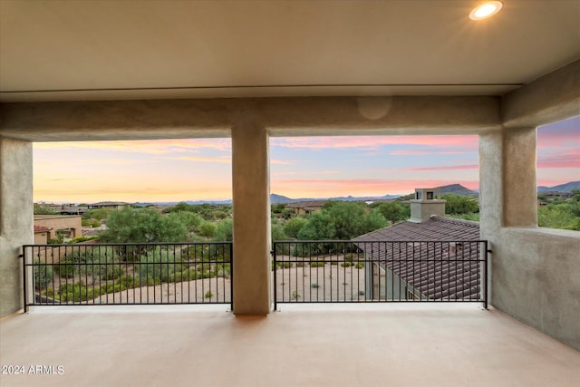 patio terrace at dusk with a balcony