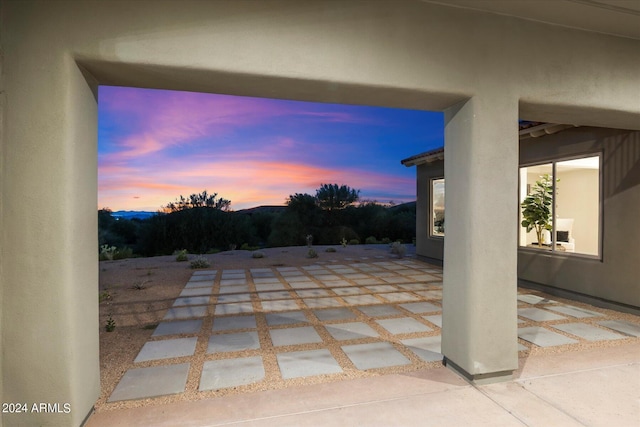 view of patio terrace at dusk