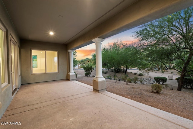 view of patio terrace at dusk