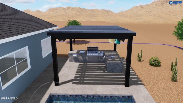 view of patio featuring a mountain view and a gazebo