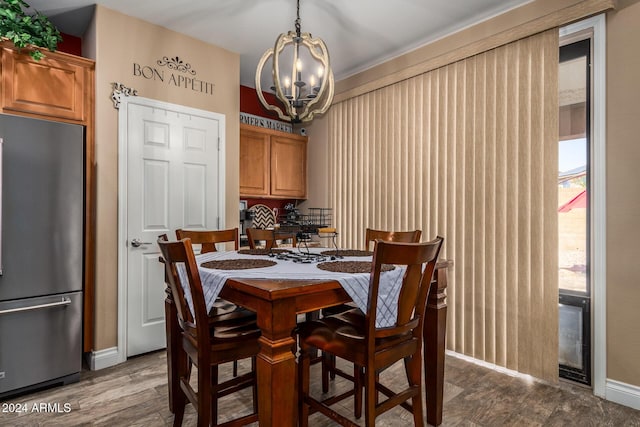 6084 W Yorktown Way, Florence, AZ 85132 - dining area with baseboards, dark wood-style floors, and a notable chandelier