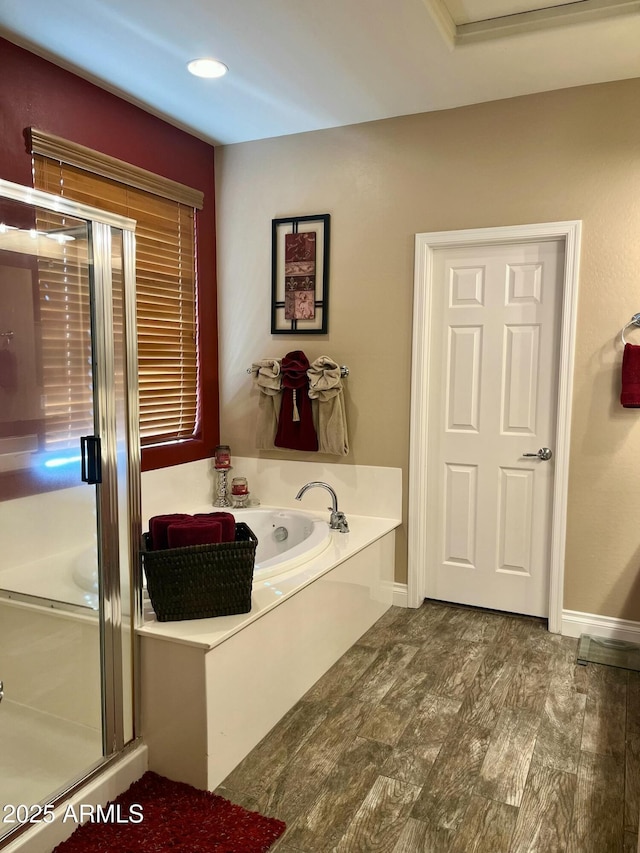 6084 W Yorktown Way, Florence, AZ 85132 - bathroom featuring a bath, baseboards, a shower stall, and wood finished floors