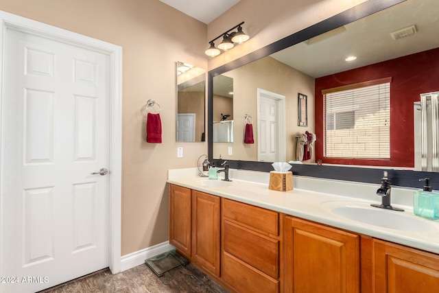 6084 W Yorktown Way, Florence, AZ 85132 - bathroom featuring a sink, baseboards, and double vanity