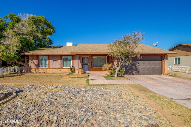 single story home featuring a garage