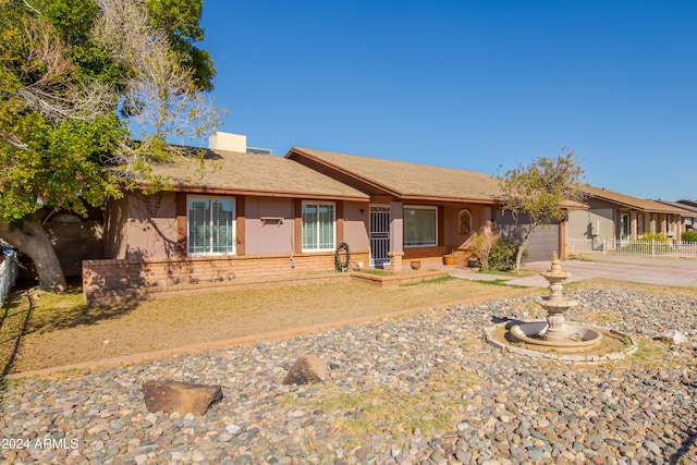 ranch-style home featuring a garage