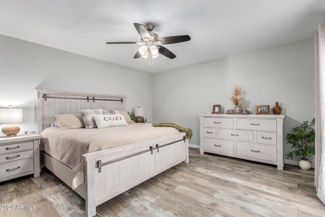 bedroom with ceiling fan and light wood-type flooring