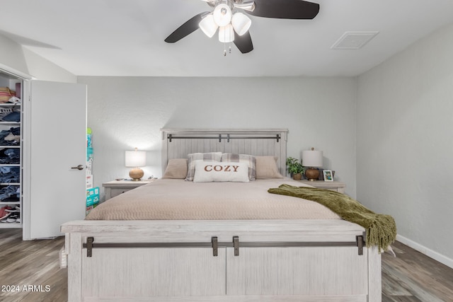 bedroom featuring light hardwood / wood-style floors, a spacious closet, and a closet