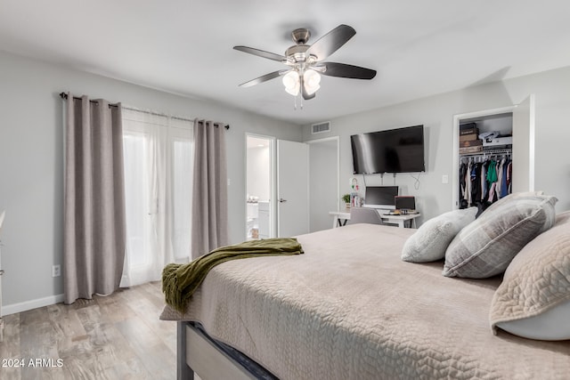 bedroom featuring light hardwood / wood-style flooring, a closet, and ceiling fan