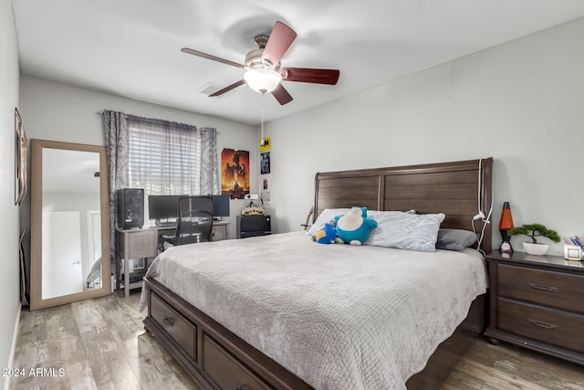 bedroom featuring ceiling fan and light hardwood / wood-style flooring