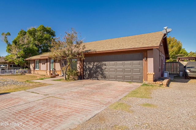 single story home featuring a garage