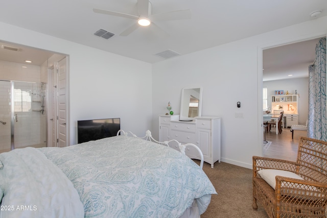 bedroom featuring connected bathroom, ceiling fan, and light carpet