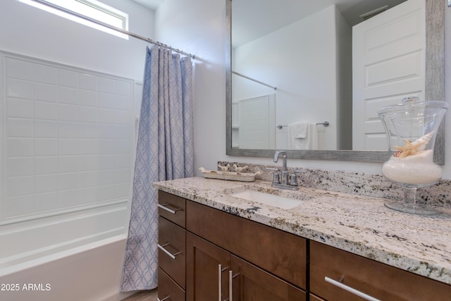 bathroom with vanity and shower / tub combo