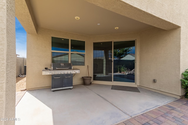 view of patio with a grill