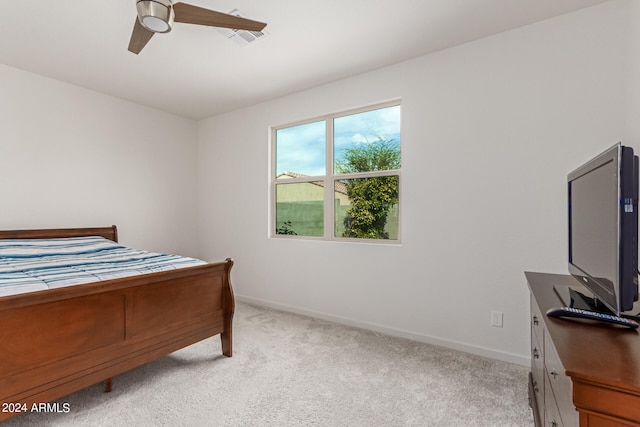 bedroom with ceiling fan and light colored carpet