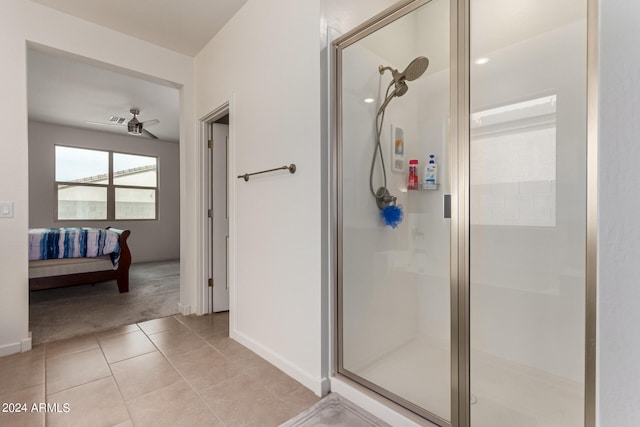 bathroom with ceiling fan, tile patterned flooring, and an enclosed shower