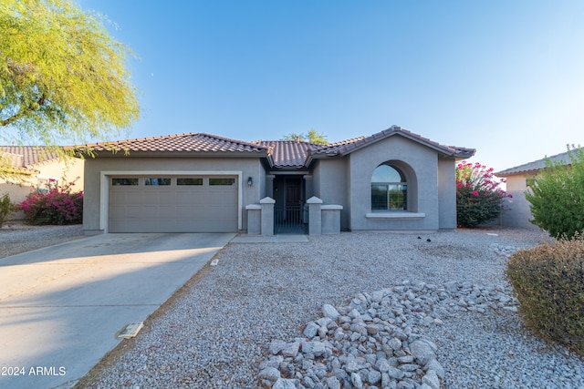 mediterranean / spanish-style house featuring a garage