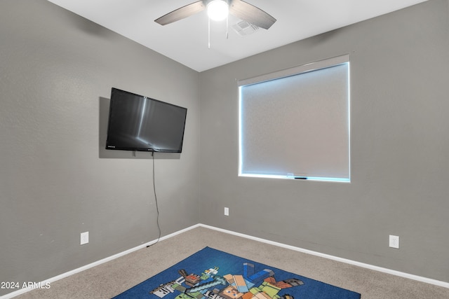 game room featuring ceiling fan and carpet