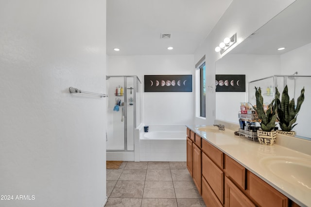 bathroom featuring vanity, separate shower and tub, and tile patterned floors