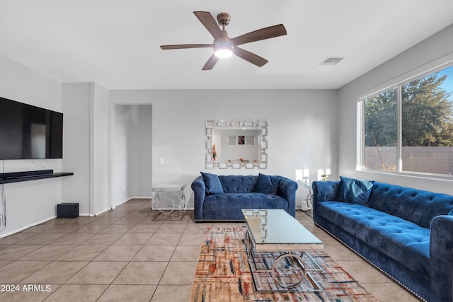 living room with ceiling fan and tile patterned floors