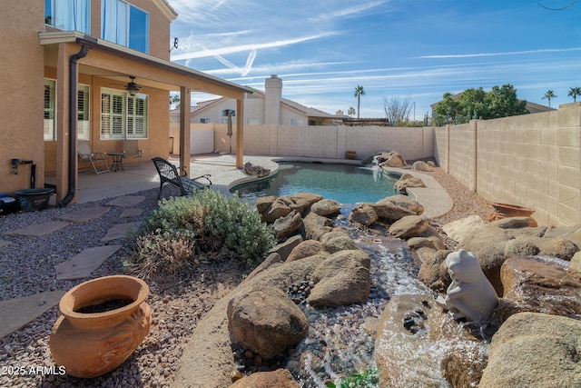 view of pool featuring ceiling fan and a patio area