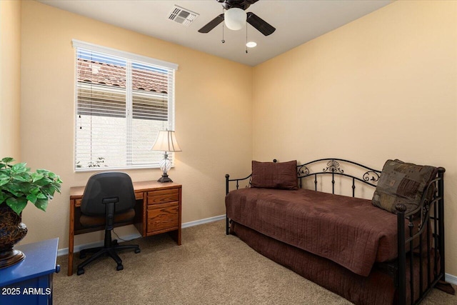 bedroom featuring a ceiling fan, visible vents, light carpet, and baseboards