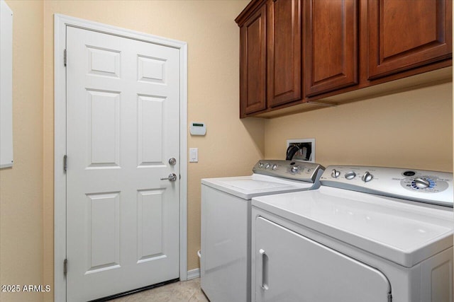 laundry area featuring cabinet space and independent washer and dryer