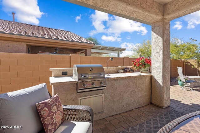 view of patio featuring a fenced backyard, grilling area, and area for grilling