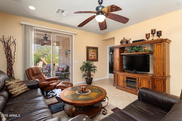 living room with light tile patterned floors, ceiling fan, recessed lighting, visible vents, and baseboards