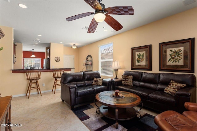 living room featuring visible vents, baseboards, ceiling fan, light tile patterned flooring, and recessed lighting