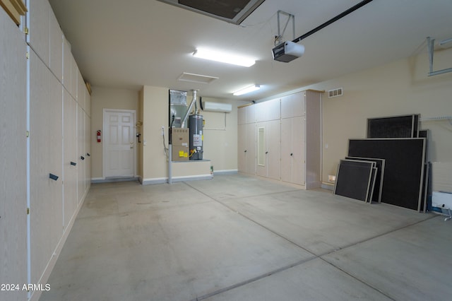 garage with a garage door opener and water heater