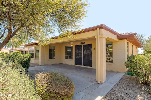 rear view of property with a patio area