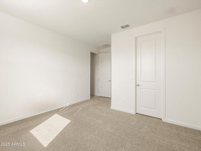 unfurnished bedroom with light colored carpet